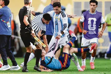 Argentina's midfielder Leandro Paredes clashes with Spain's midfielder Gavi during the 2026 World Cup football tournament final match between Spain and Argentina.