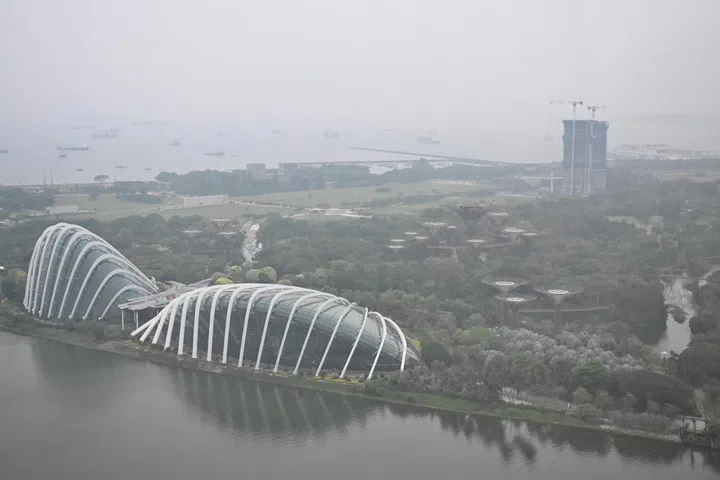 The Singapore skyline shrouded in the haze seen from the Marina Bay Street Circuit at 5pm on Oct 10, 2026. 