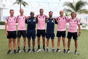 Ganesan Maniam (third from left) with trainers and referees, including Slovenian Slavko Vincic (centre) who officiated the 2026 FIFA World Cup final between Spain and Argentina.