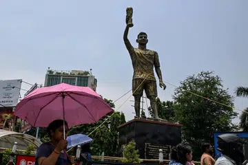 The statue of Argentinian footballer Lionel Messi that has been secured with ropes for stability from rain and thunderstorms.