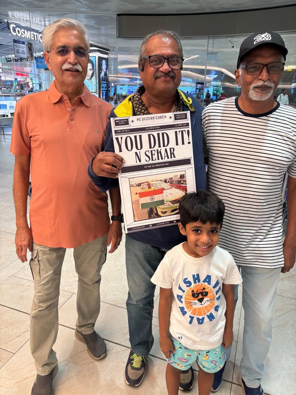 Mr Sekar with his friends and grandson.