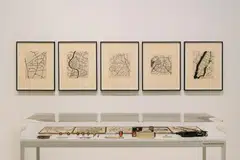 Zarina’s fascination with architecture and flying planes heavily influenced her pieces featuring overhead maps and city layouts.