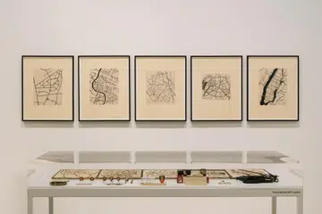 Zarina’s fascination with architecture and flying planes heavily influenced her pieces featuring overhead maps and city layouts.