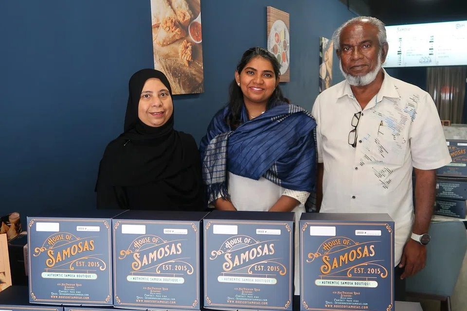 House of Samosas’ business manager Najeera Roseni (centre), owner Haja Nizamuddeen (right) and founder Noorul Ayn with the SME 500 plaque.