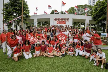 The Waterside condominium residents pose with MP Gho Sze Kee amidst the festive decorations at their National Day celebration on July 27.