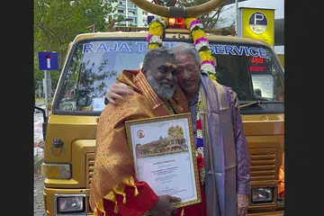Mr Rajendran Krishnasamy with Senior Minister Teo Chee Hean after being honoured.