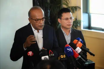 Coordinating Minister for National Security and Minister for Home Affairs K Shanmugam and Minister for Education Desmond Lee briefing about radicalised teens.