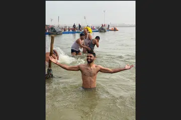 Content creator Avi Dixit after his dip at the confluence of the sacred Ganga, Yamuna and Saraswati rivers in Prayagraj, Uttar Pradesh. 