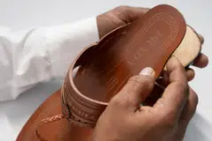 Prada launched Made In India Kolhapuri chappals, alongside a training programme dedicated to artisans from the districts in India where Kolhapuri Chappals are traditionally manufactured.