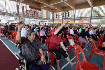 370 residents participated in Singapore’s Largest Mass Chair Yoga session at Toa Payoh on June 22.