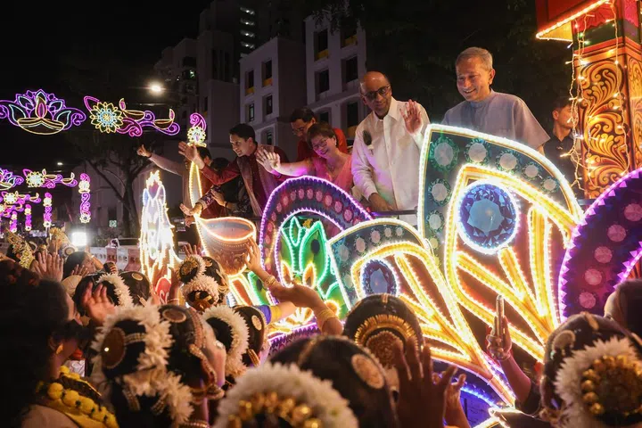 President Tharman Shanmugaratnam and other dignitaries on board a special peacock-themed float that paraded down Serangoon Road as a part of the celebrations.