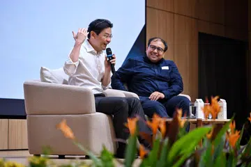 Prime Minister Lawrence Wong and The Straits Times’ associate editor Zakir Hussain at a dialogue with the Singapore Press Club in Toa Payoh on June 8.