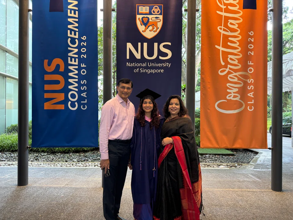 Recipient of the Batul Izzuddin Global Citizen Prize, 22-year-old Kashvi Raj, with her parents at her graduation ceremony.