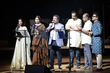 (From left) Seethalakshmi Puthunilam, Mridula Warrier, Sudeep Kumar, Emcee Jayaraj Warrier, composer Ouseppachan and Nikhil Mathew.
