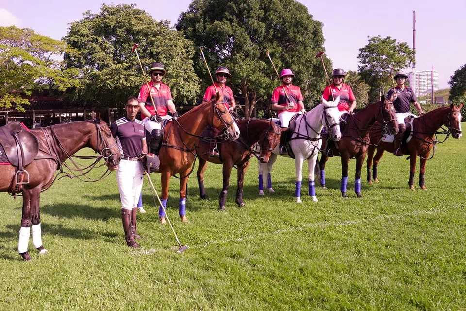 (From left) polo players Ravi Rathore, Imran Jumabhoy, Rajiv Menon, Ali Jumabhoy, Iqbal and Ranbir Singh at the Singapore Polo Club field.