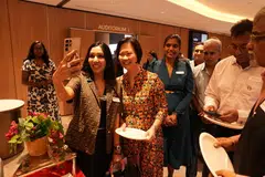 Verdus Technologies co-founder Kratti Agrawal (left) taking a selfie with Minister of State Gan Siow Huang, who interacted with guests after the dialogue.