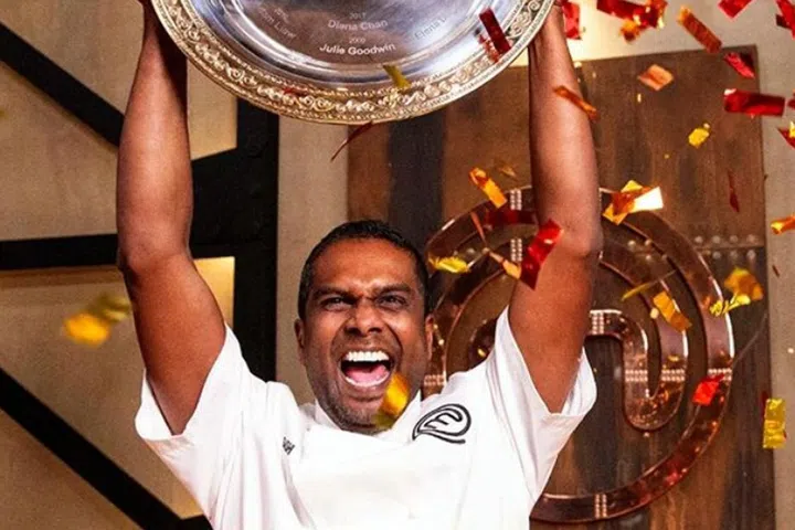 Sashi Cheliah lifts the MasterChef Australia 2018 trophy.