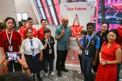 President Tharman Shanmugaratnam engaging with NDP 2026 pack artists at the National Stadium on June 30.