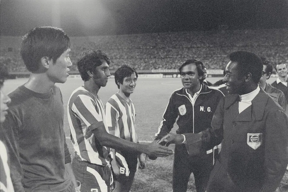 S Rajagopal shaking hands with Brazilian football legend Pele, before a match against Australia’s Bayswater United at the National Stadium in 1974. Looking on are former Singapore captain Seak Poh Leong and then-FAS deputy chairman N Ganesan.