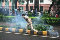 Indian police fired tear gas and baton-charged protesters in New Delhi on July 20 as they tried to march on parliament