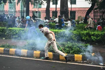 Indian police fired tear gas and baton-charged protesters in New Delhi on July 20 as they tried to march on parliament