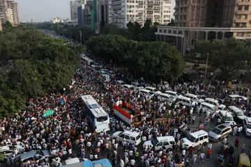 India's opposition party members march to the Supreme Court in protest against a controversial revision of voter lists that has sparked days of unrest, in New Delhi, India, October 12, 2026.