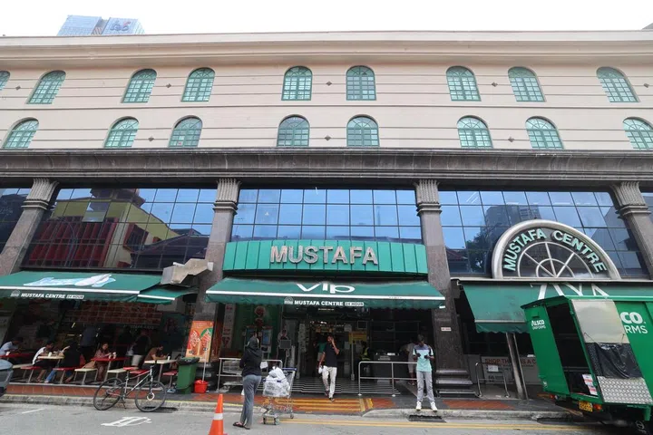 He was detained by security officers at the mall, who noticed that he was moving around suspiciously and standing near customers while carrying a bag containing the NFC device.