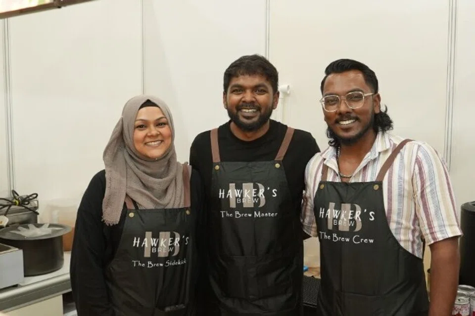 With a hope of continuing on and honouring the hawker culture, the husband-wife duo (Ms Ameena and Mr Abrulhak) started “Hawker Brew” two years ago, and they have set up a stall at the expo. (From left to right): Ms Ameena Halilur Rahman, 29, Mr Abrulhak Faizar, 32, Mr Ashiq Ilahi, 26