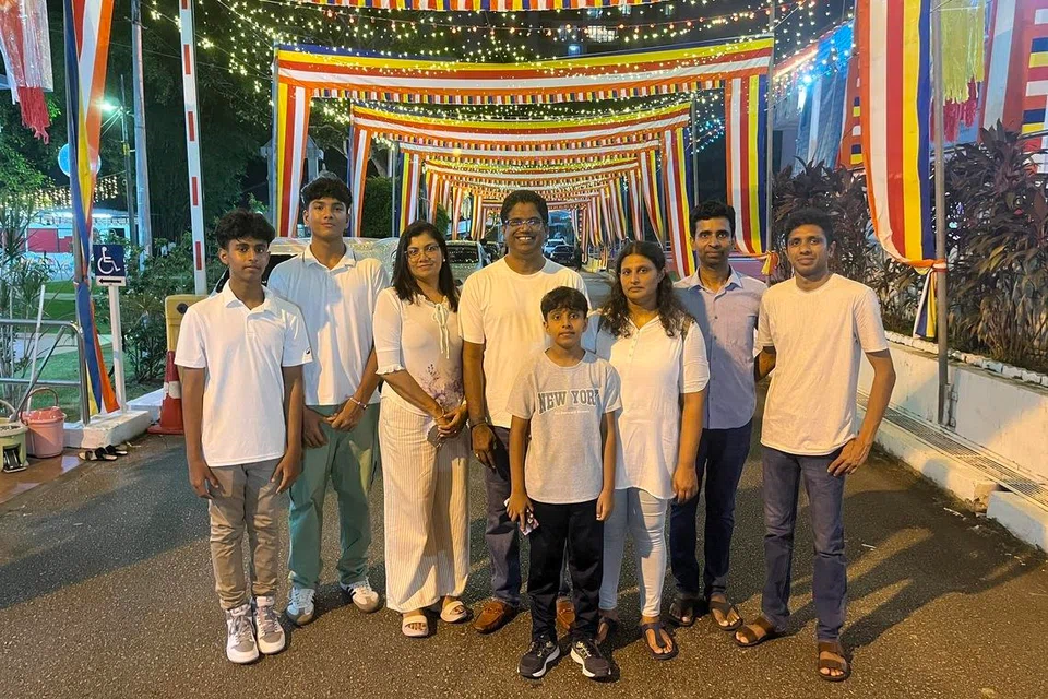 The two brothers – Mr Sachith Dardhana and Mr Nuwan Weerasinghe – and their respective families plus family friend at Sri Lankaramaya Temple on May 30.