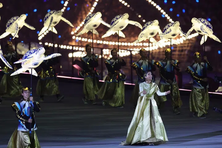 Vocalist Sushma Soma performing a Karnatik ode to Singapore as performers from Soka Gakkai Singapore emerge with marine animal puppets during Chapter 3 of NDP Preview 1 at the National Stadium on July 25, 2026.