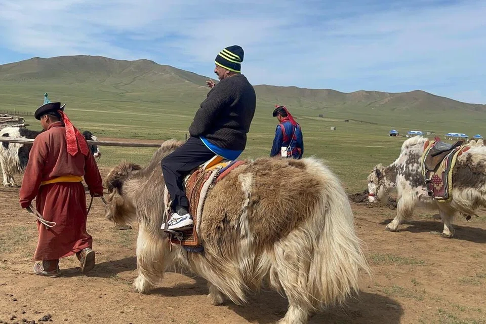 Anil Sachdeva riding a domestic yak.