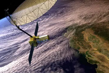 An artist’s concept depicting the NISAR satellite in orbit over central and Northern California. 