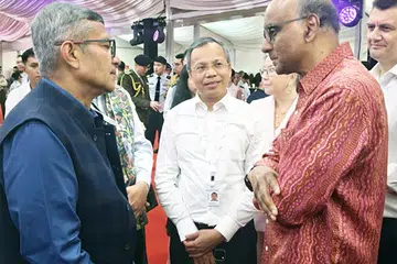 India’s Defence Secretary Rajesh Kumar Singh (left) meeting President Tharman Shanmugaratnam at the Istana reception.