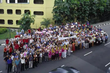 Staff gather for a group shot outside the Times House building at 390, Kim Seng Road, before moving to News Centre at Toa Payoh North in 2002.