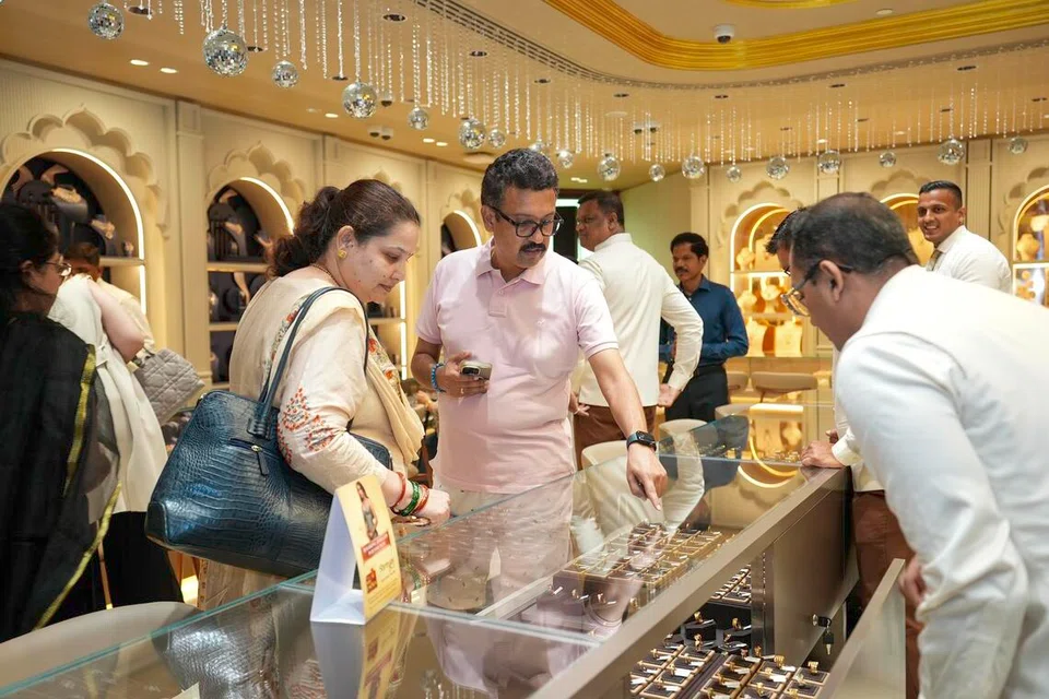 Invited guests taking a look at the collections on offer at the launch event of Bhima Jewellers’ first store in Little India, Singapore.