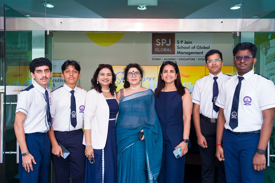 Wise Oaks International School students and principal.