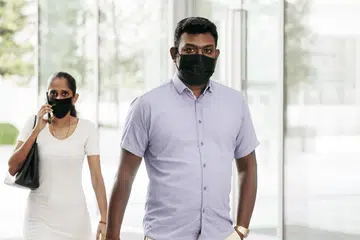 Court documents showed that Rebecca Rubini Ravinthiran (left) had organised two public assemblies with the help of her husband Vee Derrick Mahendran (right)