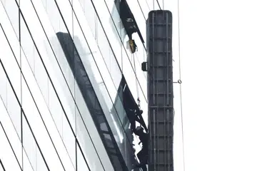 A gondola was seen hanging from the exterior of the building.