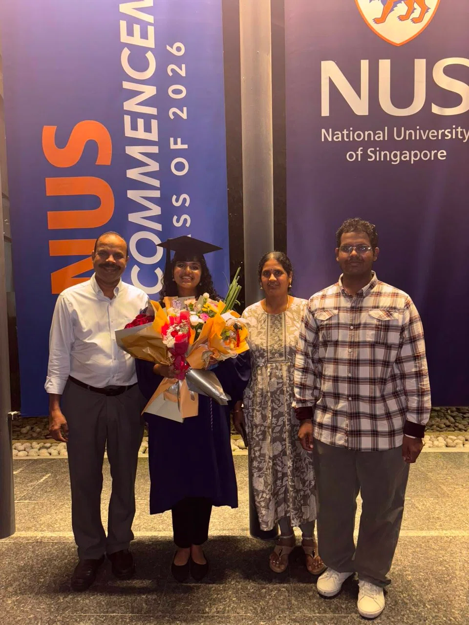 Recipient of the Syed Ahmad Khan AMU Memorial Prize, 23-year-old Mathivanan Divyaa, with her family at her graduation ceremony.