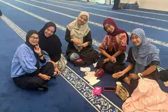 Young women and their friends at the Raja Hamidah Grand Mosque in Batam Centre.
