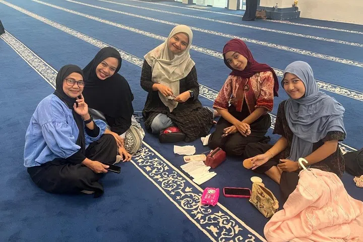 Young women and their friends at the Raja Hamidah Grand Mosque in Batam Centre.