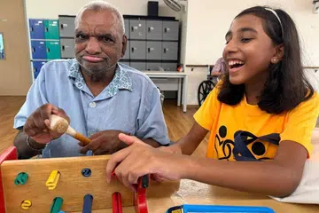 Dipna doing some activities with Mr William at Ling Kwang Home.