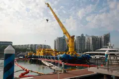 Salvage operations last month to remove the remains of a yacht which caught fire in June, at ONE°15 Marina Club at Sentosa Cove