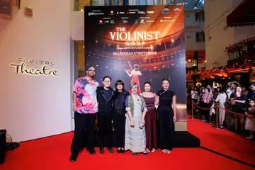 Executive producer Justin Deimen (in pink shirt) and the members of The Violinist’s production team at the Singapore gala premiere.