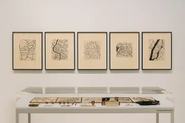 Zarina’s fascination with architecture and flying planes heavily influenced her pieces featuring overhead maps and city layouts.