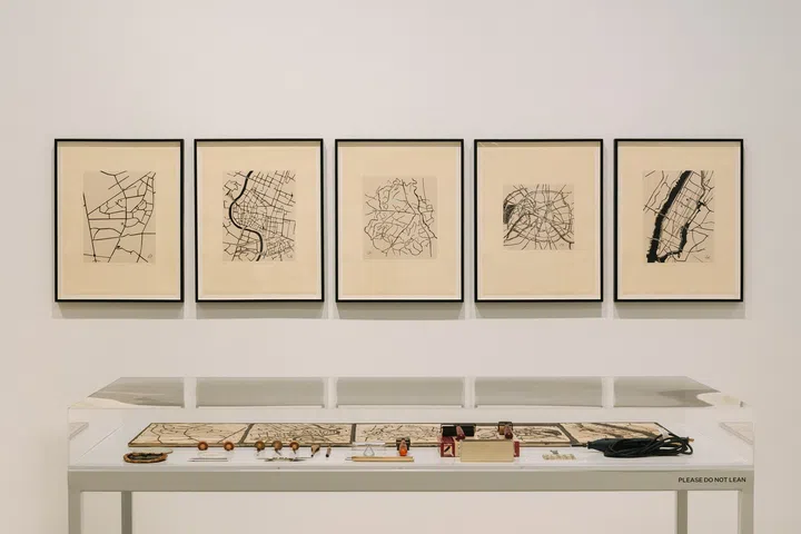 Zarina’s fascination with architecture and flying planes heavily influenced her pieces featuring overhead maps and city layouts.