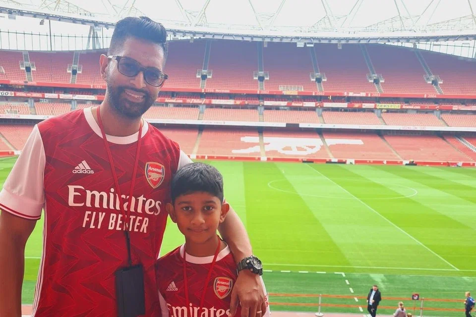 Jegathishwaran Devarajan with his son at a match
