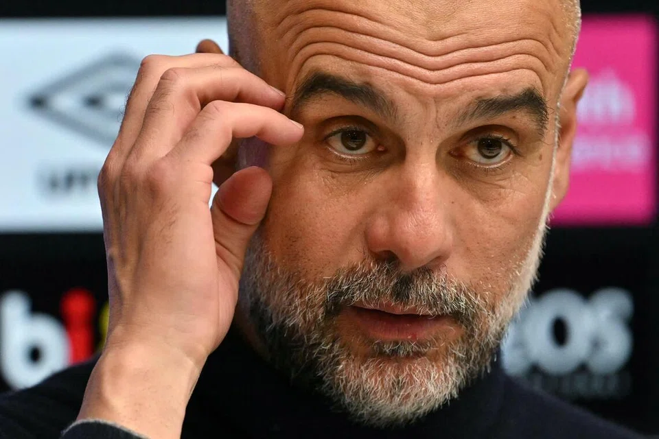 Manchester City's Spanish manager Pep Guardiola reacts during a press conference after the English Premier League football match between Bournemouth and Manchester City at the Vitality Stadium in Bournemouth on May 19.
