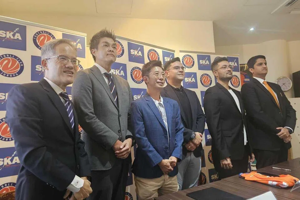 Football Association of Singapore general secretary Badri Ghent (fourth from left) welcomed the deal, describing it as a significant development for the league.
