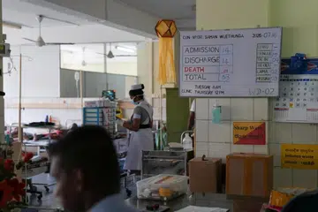 A white board with general information on dengue patients inside a ward at District General Hospital in Negombo